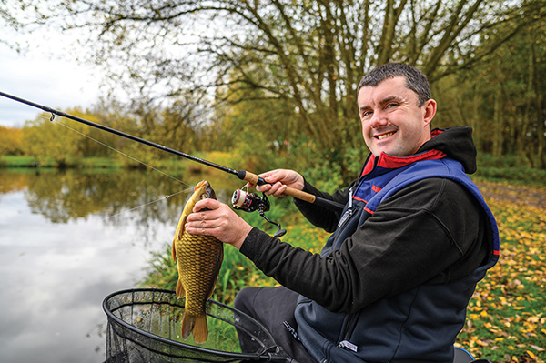 Fisherman's reel, mounted on a fishing rod. Feeder fishing in